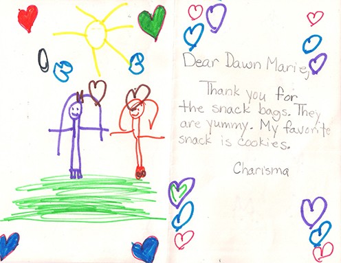 A child's hand-decorated HelpSnackz bag with a thank-you note